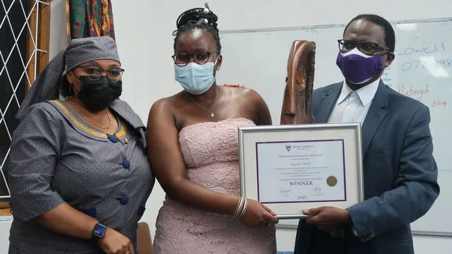 Student volunteer of the year, Luyanda Hadebe flanked by Vice-Chancellor, Dr Sizwe Mabizela and Deputy Vice-Chancellor: Academic and Student Affairs, Dr 'Mabokang Monnapula-Mapesela. 