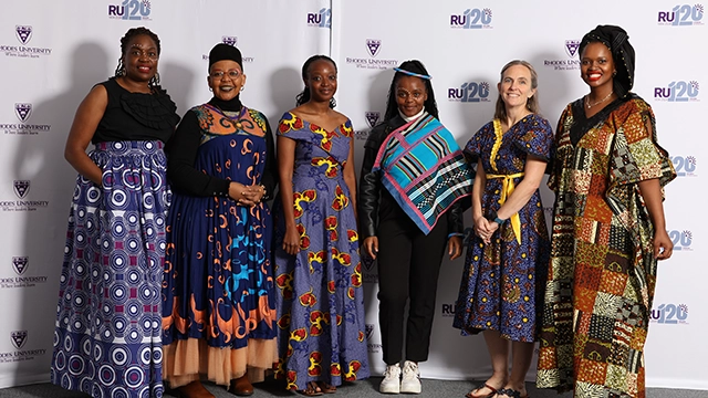 Staff and postdocs dressed in contemporary African attire for Africa Day photoshoot